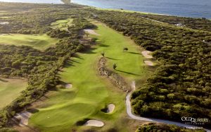 Aerial shot of Hole 17 at Old Quarry Golf Course with ocean view and natural terrain in Curaçao