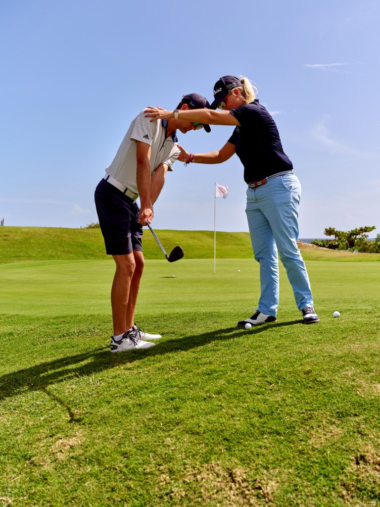 Certified PGA pro giving a golf lesson at Old Quarry Golf Course in Curaçao